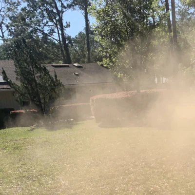 dust in the air while mowing a dry lawn in Middleburg, FL