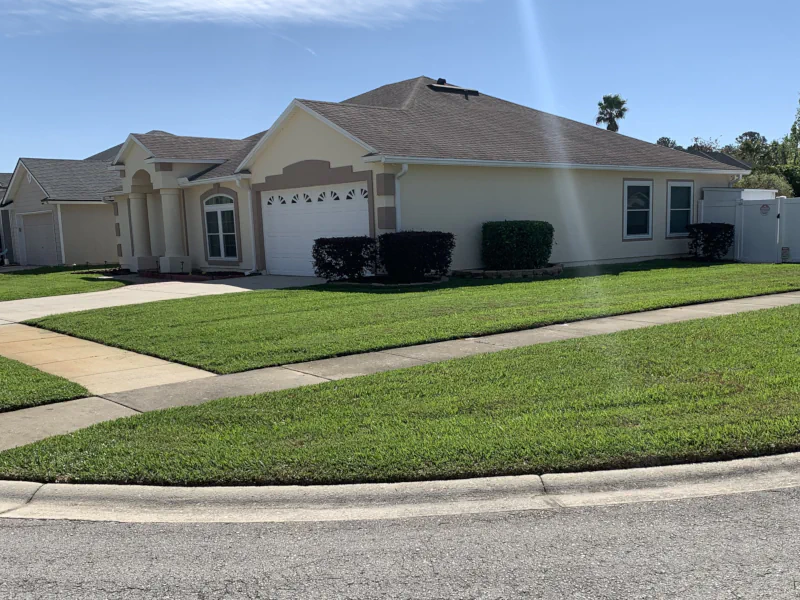 front yard of corner lot in Middleburg, FL after mowing