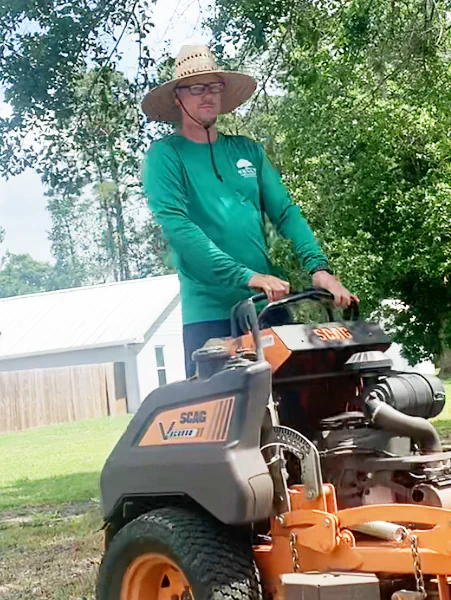 standing on lawn mower in customers yard in Lake Asbury, FL.