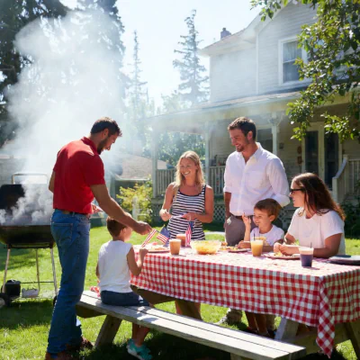 Family doing cook out on lawn